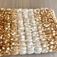 Folded Golden Fawn blanket showing ribbed texture and cream and brown spotted pattern